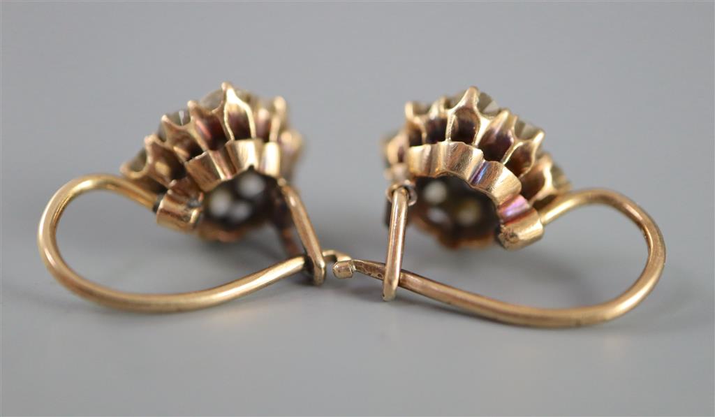 A pair of early 20th century gold and nine stone old cut diamond cluster earrings,